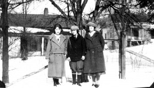 Three unknown young folks in front of the homes facing Proctor Road. where Aida (right) and her brother Lon Austin (left) lived.