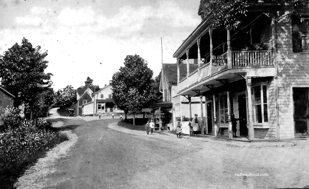 On the right is the Eldred Post Office in the Parker Hotel around 1920. In the middle of the photo is William H. Wilson's Store on the NE corner of Eldred. Postcard in Austin Collection.